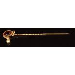 Victorian stick pin in the form of a serpent set with a foiled garnet and drop pearl