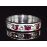 An 18k white gold ring set with diamonds and rubies, 4.2g, size N