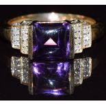 A 9ct gold ring set with a rectangular amethyst cabochon and diamonds, 3.2g, size N