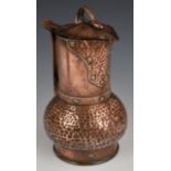 Arts & Crafts copper jug, with riveted and hammered decoration, height 27cm