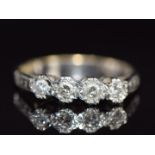An 18ct white gold ring set with four diamonds in a platinum setting, 2.7g, size K