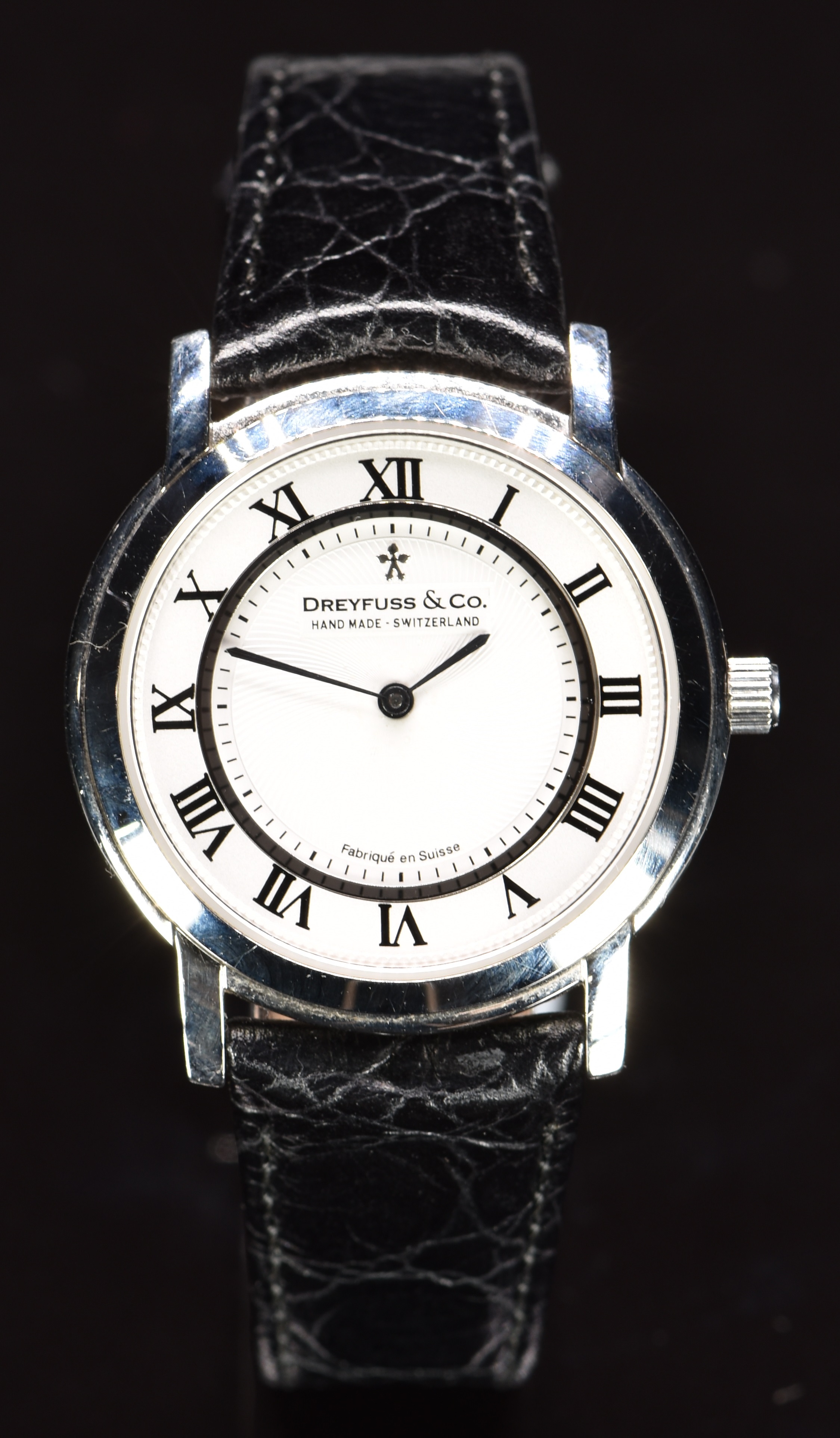 Dreyfuss & Co gentleman's wristwatch with blued hands, black Roman numerals, white dial, stainless