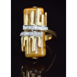 A bespoke 18k gold bi-coloured ring set with tiger's eye and diamonds, 13.8g, size M
