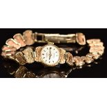 Rotary 9ct gold ladies wristwatch with black hands, two-tone hour markers, silver dial and 21