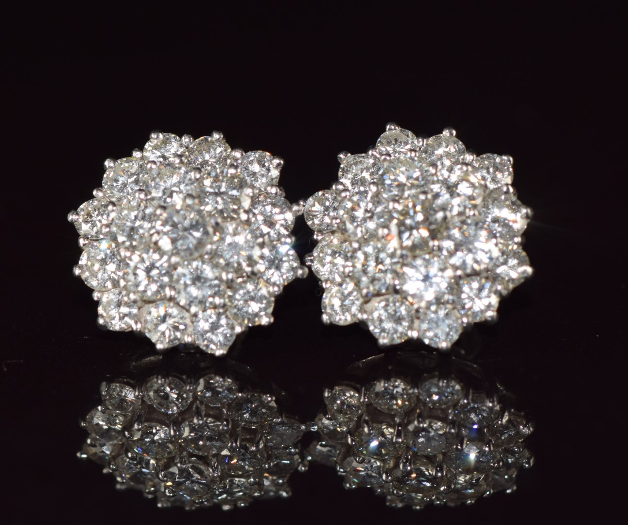 A pair of 18ct white gold earrings each set with nineteen round cut diamonds, each approximately 0. - Image 2 of 3