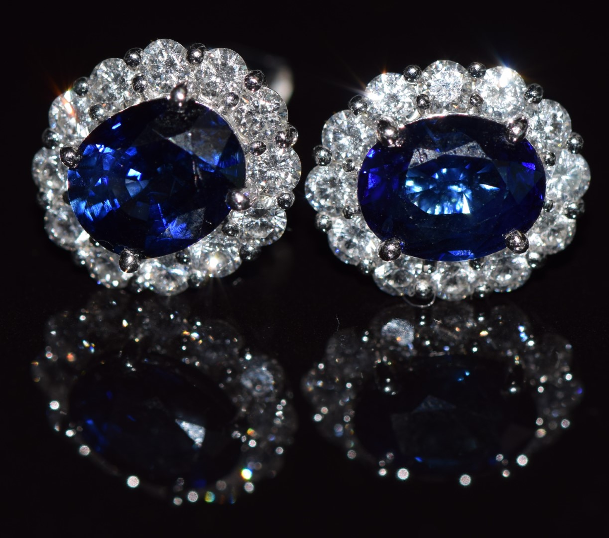 A pair of 18ct white gold earrings each set with a natural untreated 1.5ct oval cut sapphire