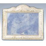 Modern hallmarked silver photograph frame with floral swag decoration and easel back, Sheffield