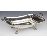 George V hallmarked silver twin handled serving dish, tray or bowl, raised on four feet, Sheffield