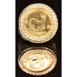 A 9ct gold ring set with a 1983 gold 1/10 Krugerrand, 6.7g, size I