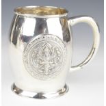 Thai silver pint or similar tankard with embossed decoration of a deity to front and back, marked to