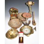Contemporary cast brass or bronze and polished art metal candlesticks and bowls, some with impressed