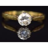 An 18ct gold ring set with a round cut diamond of approximately 0.66ct, 2.7g, size N