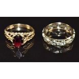 A 9ct gold eternity ring set with spinel and a 9ct gold ring set with a garnet, 4.4g, size J & I