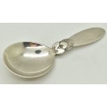 George Jensen hallmarked silver cactus pattern caddy spoon, import marks for London 1947, length 9.