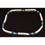 A necklace of pearl, malachite, lapis lazuli and 14k gold beads, with 14k gold clasp