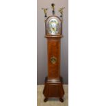 Walnut cased grandmother clock with figural decoration, moonphase, date and J M Verbrugge, Amsterdam