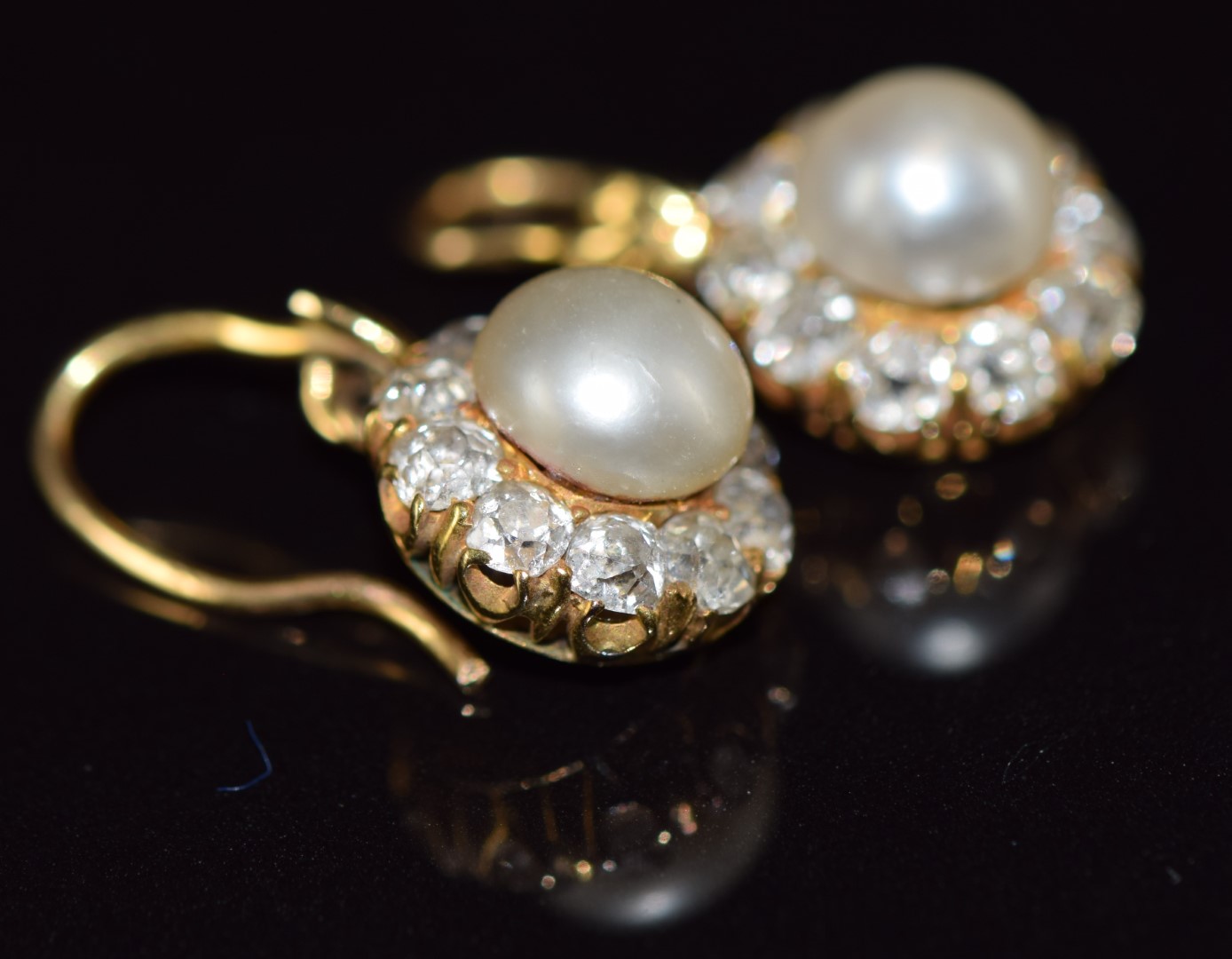 A pair of c1900 18ct gold earrings, each set with a natural pearl measuring 6.4mm surrounded by - Image 3 of 5