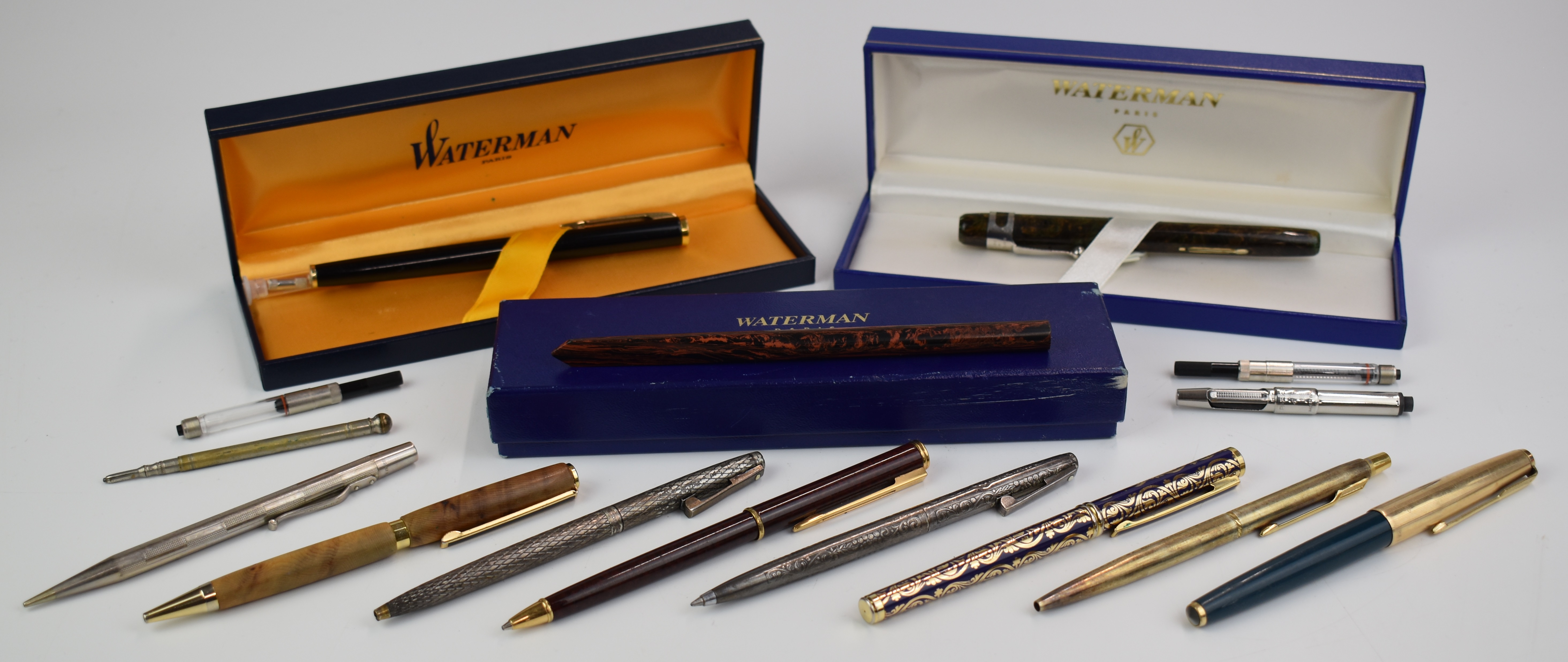 Twelve fountain pens, pencils etc, including Parker 51, Waterman with 18k gold nib, vintage Waterman