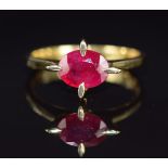 An 18ct gold ring set with an oval cut ruby of approximately 1.5ct, 3.7g, size M/N