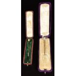 Two 9ct gold stick pins (c1900), both set with natural pearls (2.6g), in antique boxes