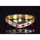 An 18ct gold half eternity ring set with rubies and diamonds, 3.7g, size O