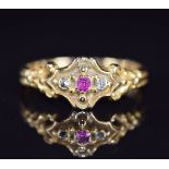 An 18ct gold ring set with a ruby and diamonds, 2.4g, size M