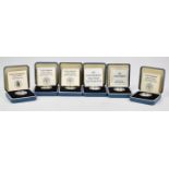 Six cased Royal Mint proof silver 'round pound' coins, various reverses, issued between 1980 and