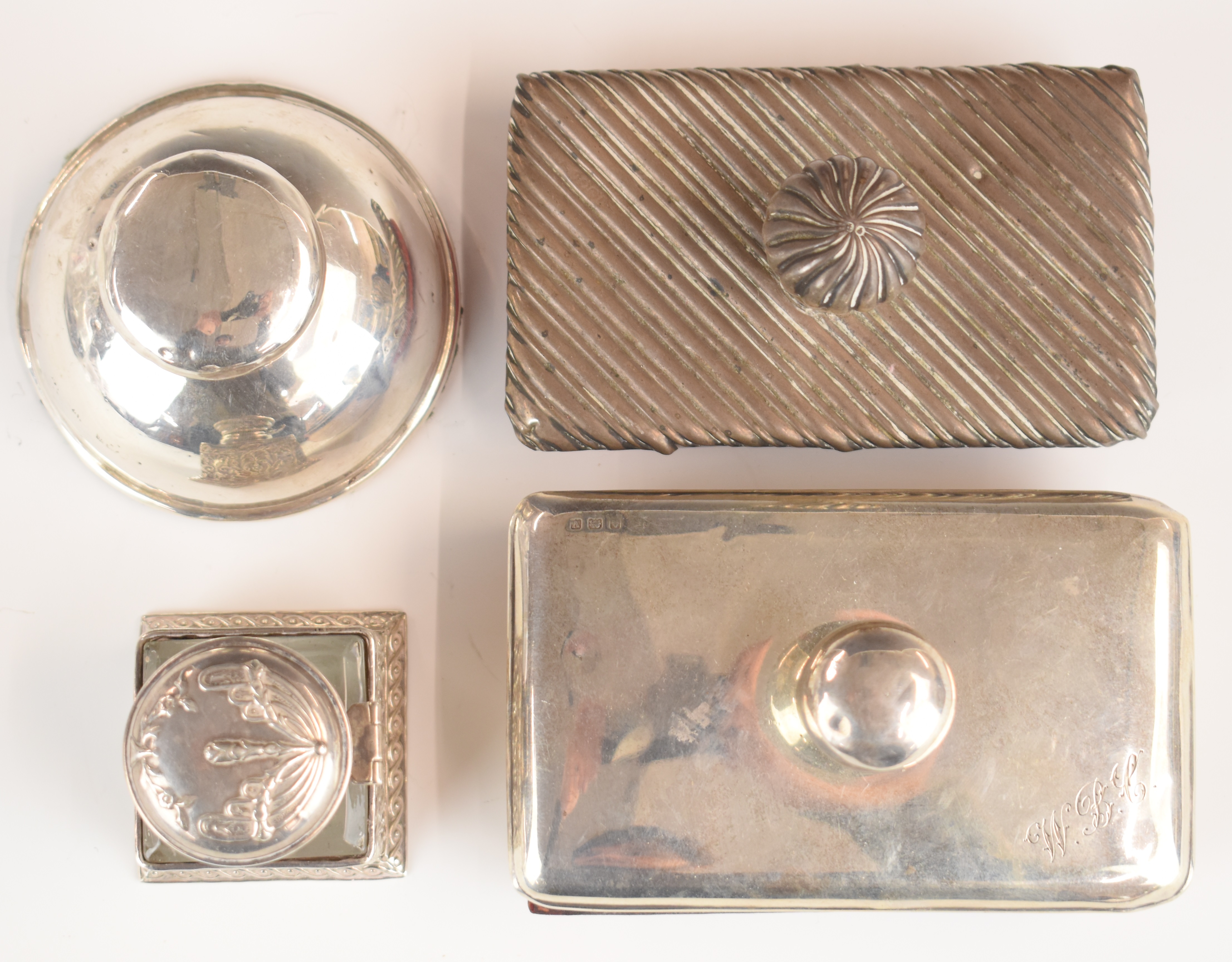 Two hallmarked silver mounted desk blotters together with two hallmarked silver inkwells, length