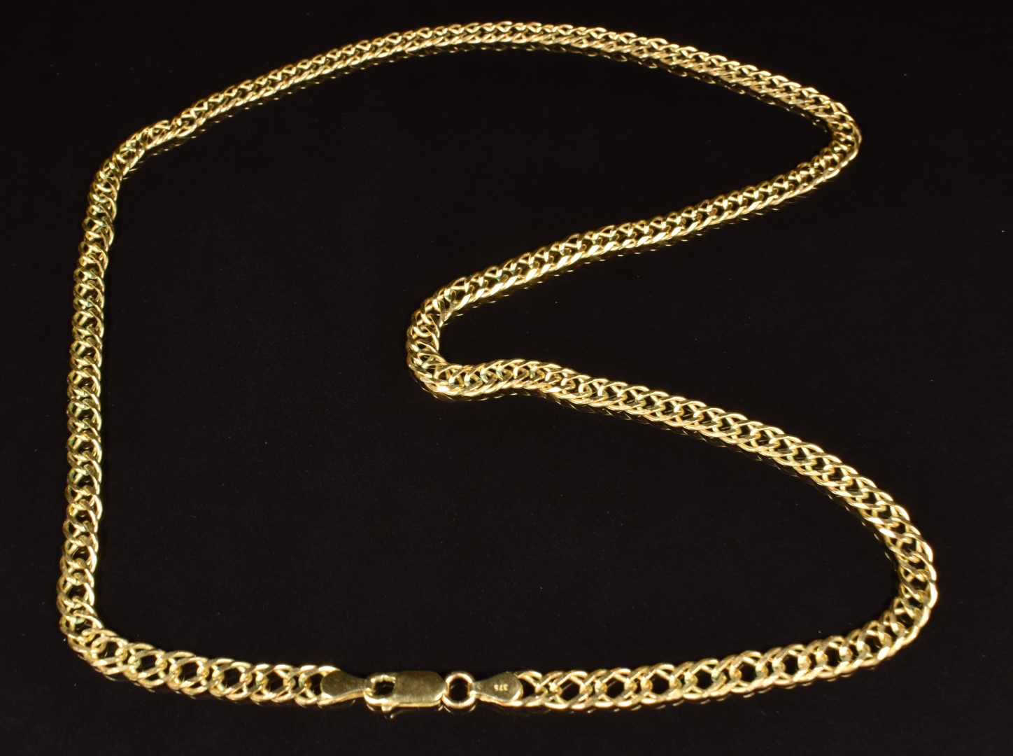 A 9ct gold necklace made up of interlocking links, length 55cm, 16.9g