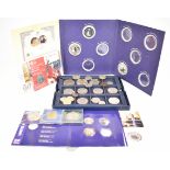 A collection of modern commemorative coins in a Westminster case, together with some presentation