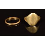 A 22ct gold wedding band / ring (1.2g) and an 18ct gold signet ring (5.9g, band has split)