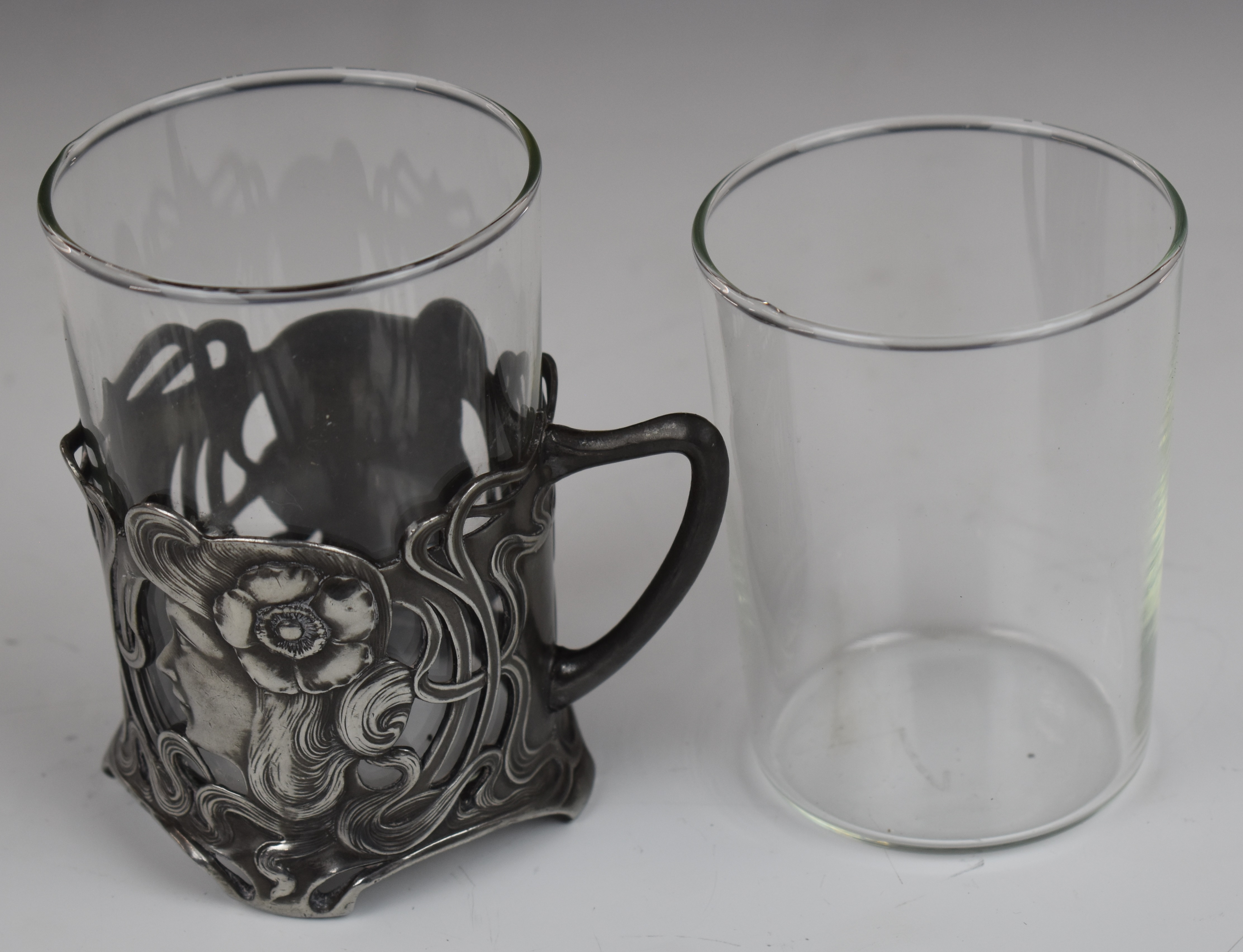Pair of WMF Art Nouveau pewter glass beaker holder with stylised ladies, height 10.5cm