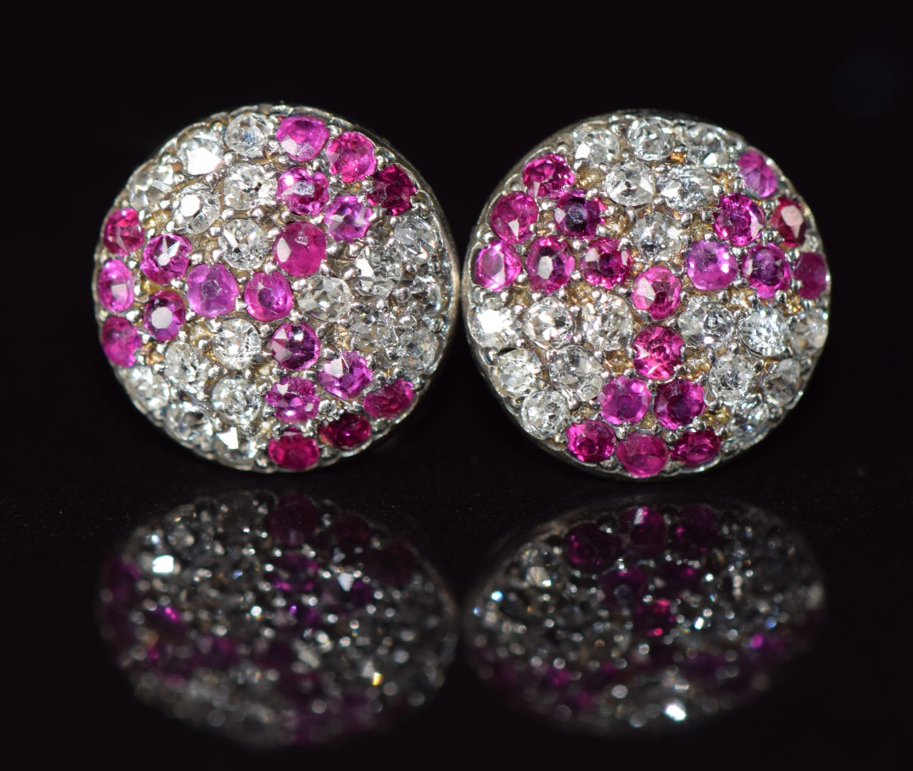 A pair of Art Deco platinum earrings each set with old cut rubies and diamonds, 3g, 1cm diameter