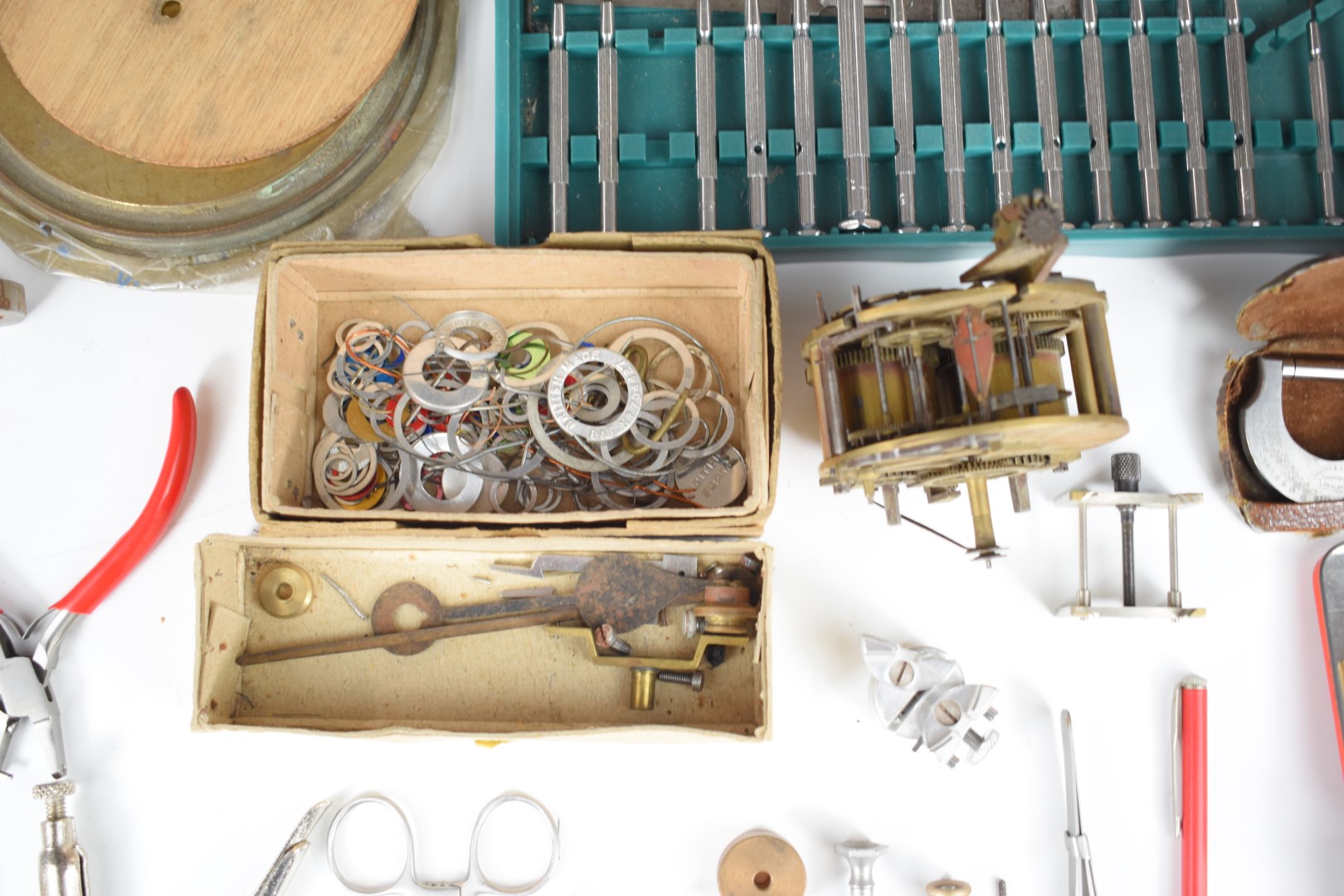 Collection of clock parts, keys, tools, needle files, engraver's wax, clamps etc, in three trays - Image 16 of 21