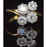 An 18ct gold ring set with four round cut diamonds, total diamond weight approximately 1.5ct, 5.
