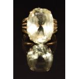 A 9ct gold ring set with an oval cut citrine, 5.6g, size L