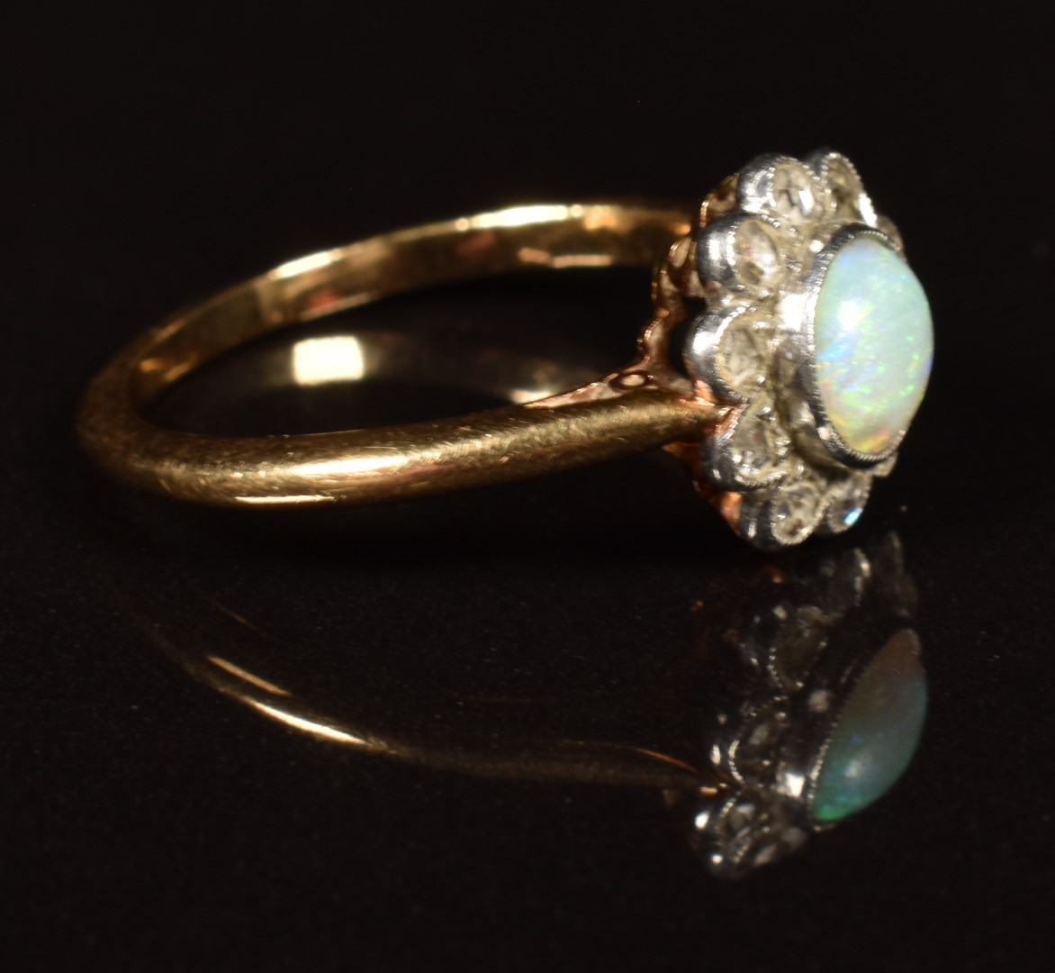 An 18ct gold ring set with an opal surrounded by rose cut diamonds, in vintage box, 2.9g, size M - Image 2 of 3