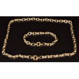 A 14k gold bi-coloured necklace made up of oval knotted links, length 33cm, 26.8g