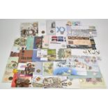 Thirty four coin/stamp covers comprising seventeen 50p examples and seventeen £1 examples,