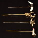 Victorian 9ct gold stick pin set with two teeth, a yellow metal stick pin and two further