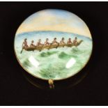 A 19th/20thC 9ct gold and enamel roundel decorated with figures in a dugout canoe, probably