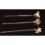 Edwardian 15ct gold stick pin (1.2g) and two Edwardian 9ct gold stick pins, all set with seed pearls