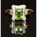 A 9ct gold ring set with an emerald cut peridot and diamonds, 2.0g, size K