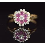 A 9ct gold ring set with rubies and diamonds in a cluster, 2g, size L