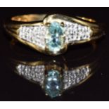 An 18ct gold ring set with paraiba tourmaline and diamonds, 4.0g, size M/N