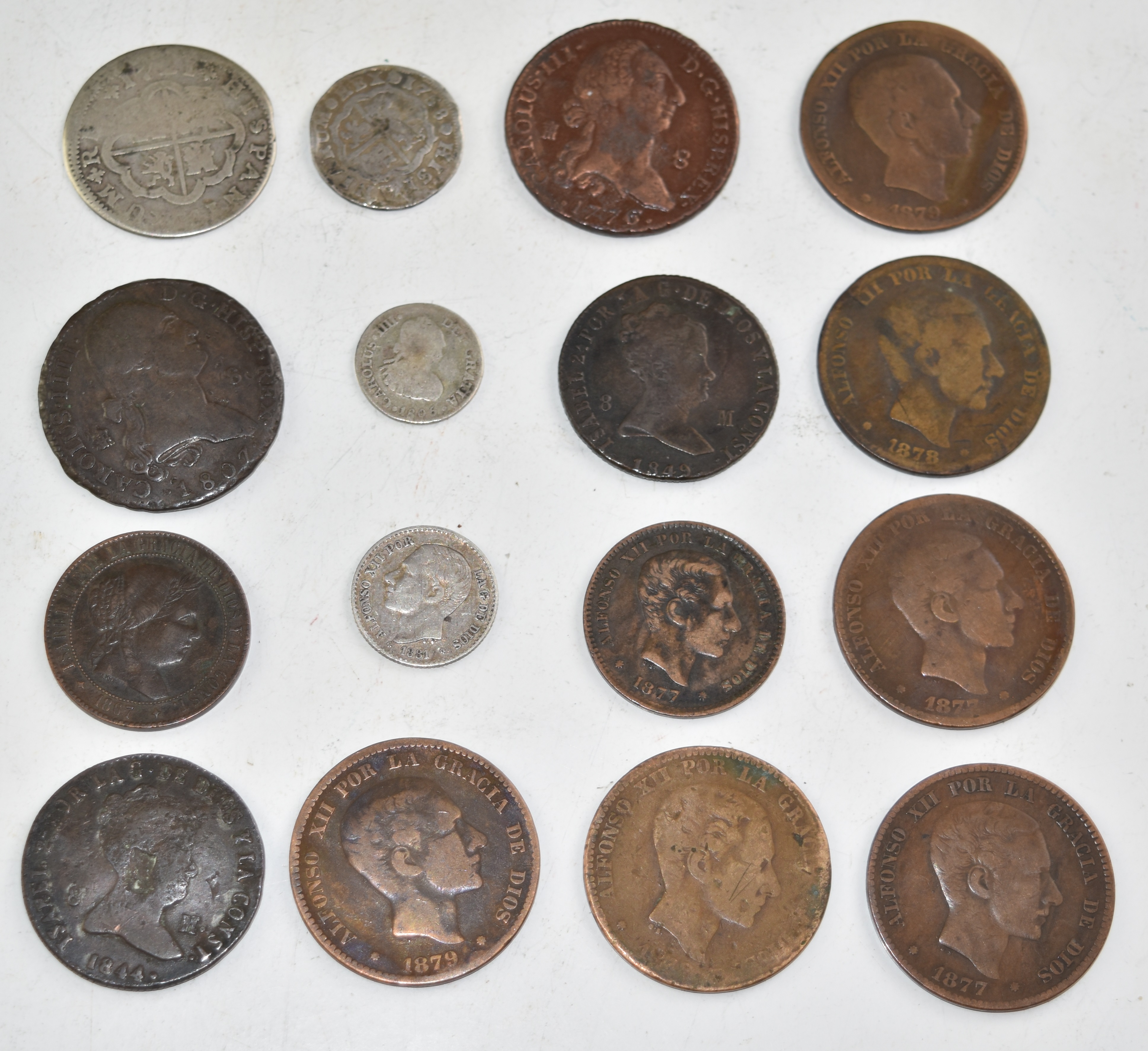 Sixteen Spanish coins 1721 onwards, includes hammered example, four silver and twelve copper /