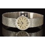 Omega 18ct white gold ladies wristwatch ref. 7185 with black hands and baton hour markers, silver