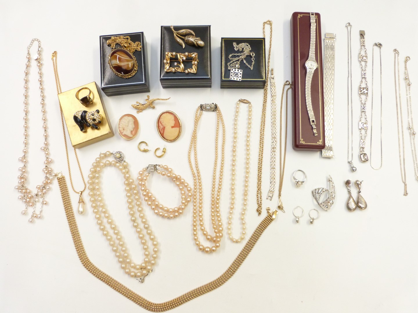 A collection of costume jewellery including Scottish silver bracelet, Hollywood pendant, silver