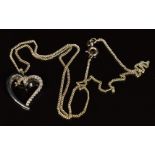 A 9ct white gold pendant in the form of a heart set with diamonds, totalling approximately 0.15ct,