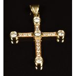 A 14k gold cross pendant set with diamonds, the largest approximately 0.18ct, 4.9g